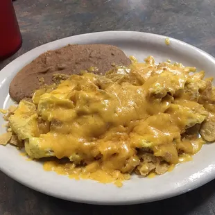 The migas are served with cheese and with tortillas on the side as well, the beans are good.