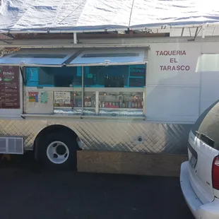 a taqueria truck parked in a parking lot
