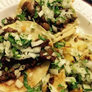 Asada tacos, chicken, and adobada (marinated beef)