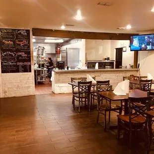 Interior seating and counter. The talented cooks are busy working in the open concept kitchen.