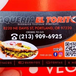 a hand holding a business card