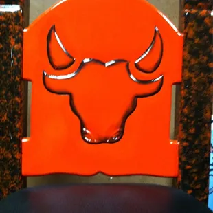 a bull head on a chair