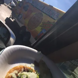a taco on a paper plate