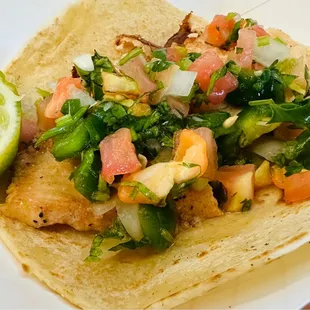 Pescado - Grilled tilapia topped with spicy pico de gallo