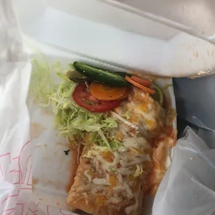 a taqueria sandwich in a styrofoam container