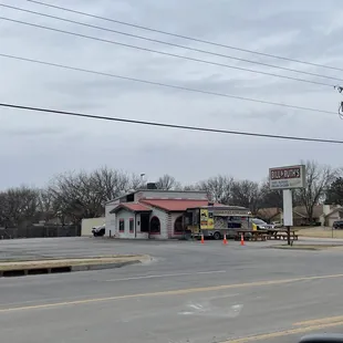 a taqueria restaurant on the corner of a street