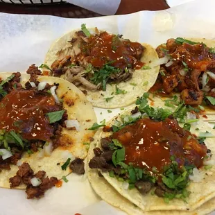 Tacos!! Pollo Adobado, Asada, Carnitas and Chorizo :) They put red sauce on all the meats, though...