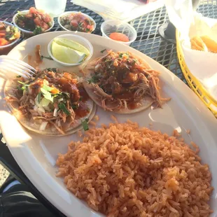 Shredded chicken tacos with a side of rice