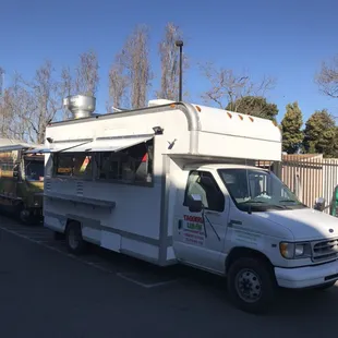 a taqueria truck parked in a parking lot
