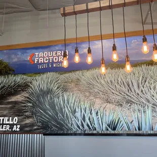 a mural of a blue agave plant