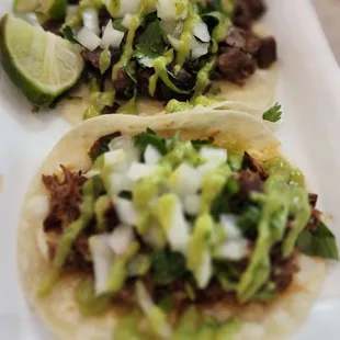 Birria tacos &amp; a Carne asada taco with birria consone