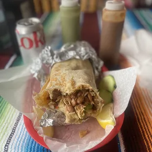 The filling of the California burrito and two sauces.
