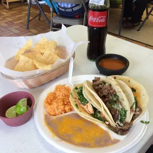Shredded beef, shredded chicken, and fried pork tacos. Don't forget the Mexican Coke.