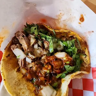 Taco de Birria on a homemade corn tortilla with salsa with some heat to it.