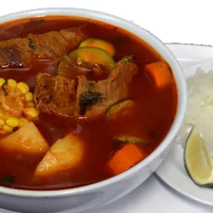 a bowl of soup and a plate of rice