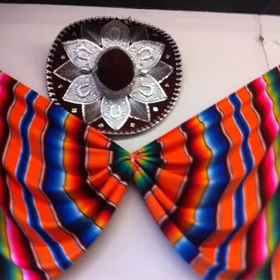 a colorful scarf with a taqueria on it