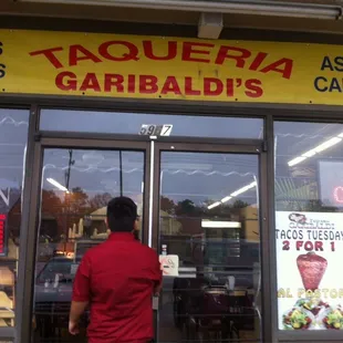 a man entering a restaurant