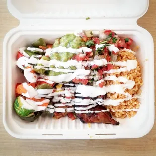 a close up of a meal in a styrofoam container