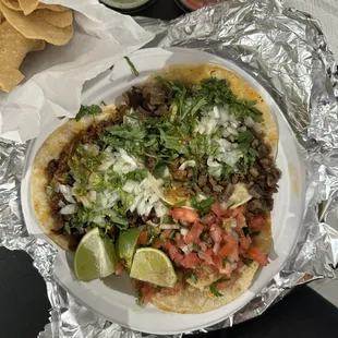 al pastor, steak, and shrimp tacos