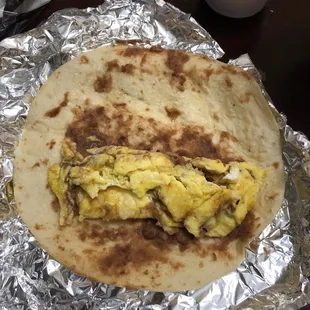 Really I order almost everyday this is not bean and egg ...just pass  the spoon across the tortilla with beans come on guad step it up