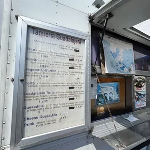 a food truck with a menu on the side