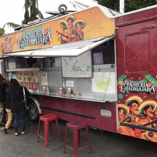 people ordering food from a food truck