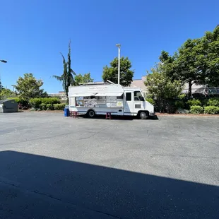 a taqueria truck parked in a parking lot