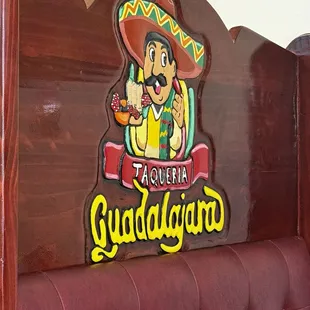 On the back of a booth
