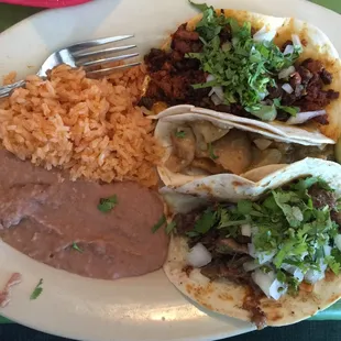 Barbacoa &amp; Campechanos Tacos. Not sure what the middle one is? I ordered Fried Pork?