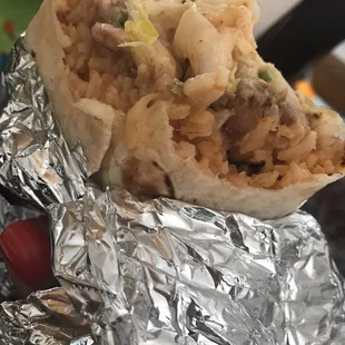 a burrito wrapped in aluminum foil