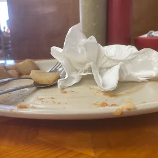 a dirty plate with a fork and knife on it