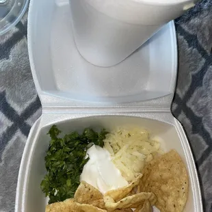 a bowl of soup and tortillas