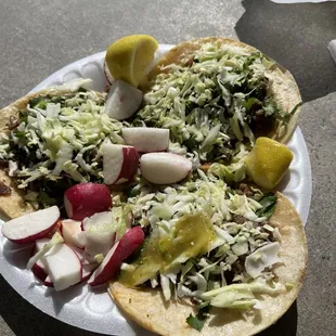 a plate of tacos on a table