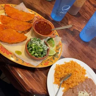 Chicken quesabirria with beans and rice