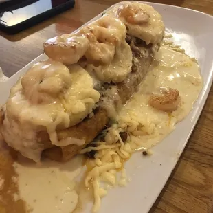 Burrito Guanajuato (steak, chicken, beans, &amp; onions inside, pineapple, shrimp, chorizo, and cheese on top)