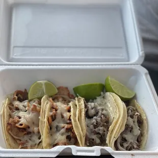 Pastor and barbacoa tacos with cheese