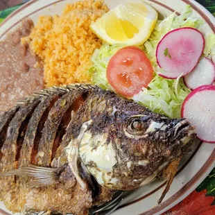 a plate of fish and rice