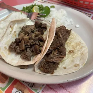 Barbacoa taco on the right