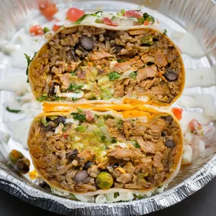 A cross-sectional shot of the Al Pastor Burrito