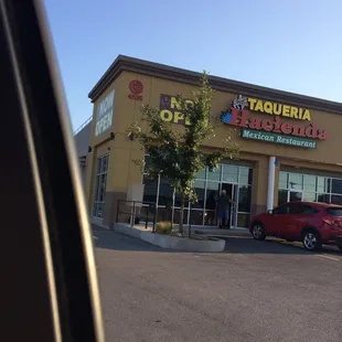 a red car parked in front