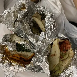 a close up of a taqueria wrapped in foil