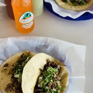 Barbacoa and bistek de mexicana tacos on flour. Salsas are good