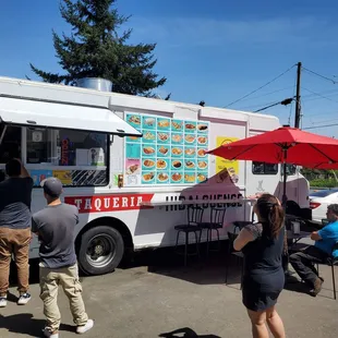 people ordering food from a food truck