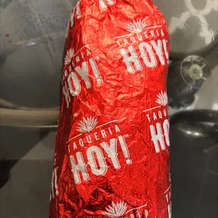 a hot dog wrapped in foil
