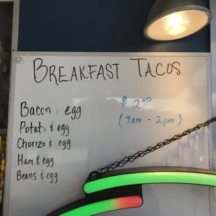 breakfast tacos on a white board