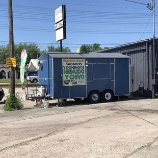a taqueria truck parked on the side of the road