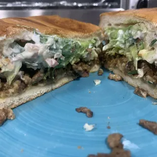 Carne Asada torta. Lettuce, pico de gallo, avocado, and mayonnaise.