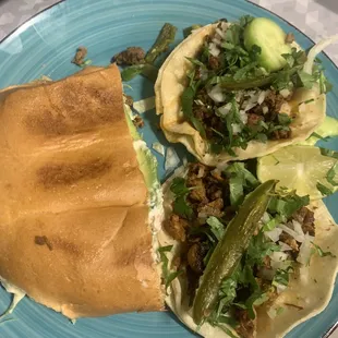 Half torta and two tacos. Chorizo street taco and al pastor.