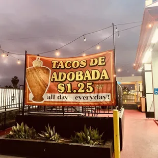 a taco de adobada sign