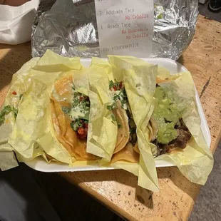 Receipt saying no guacamole and a fucking taco caked with guacamole